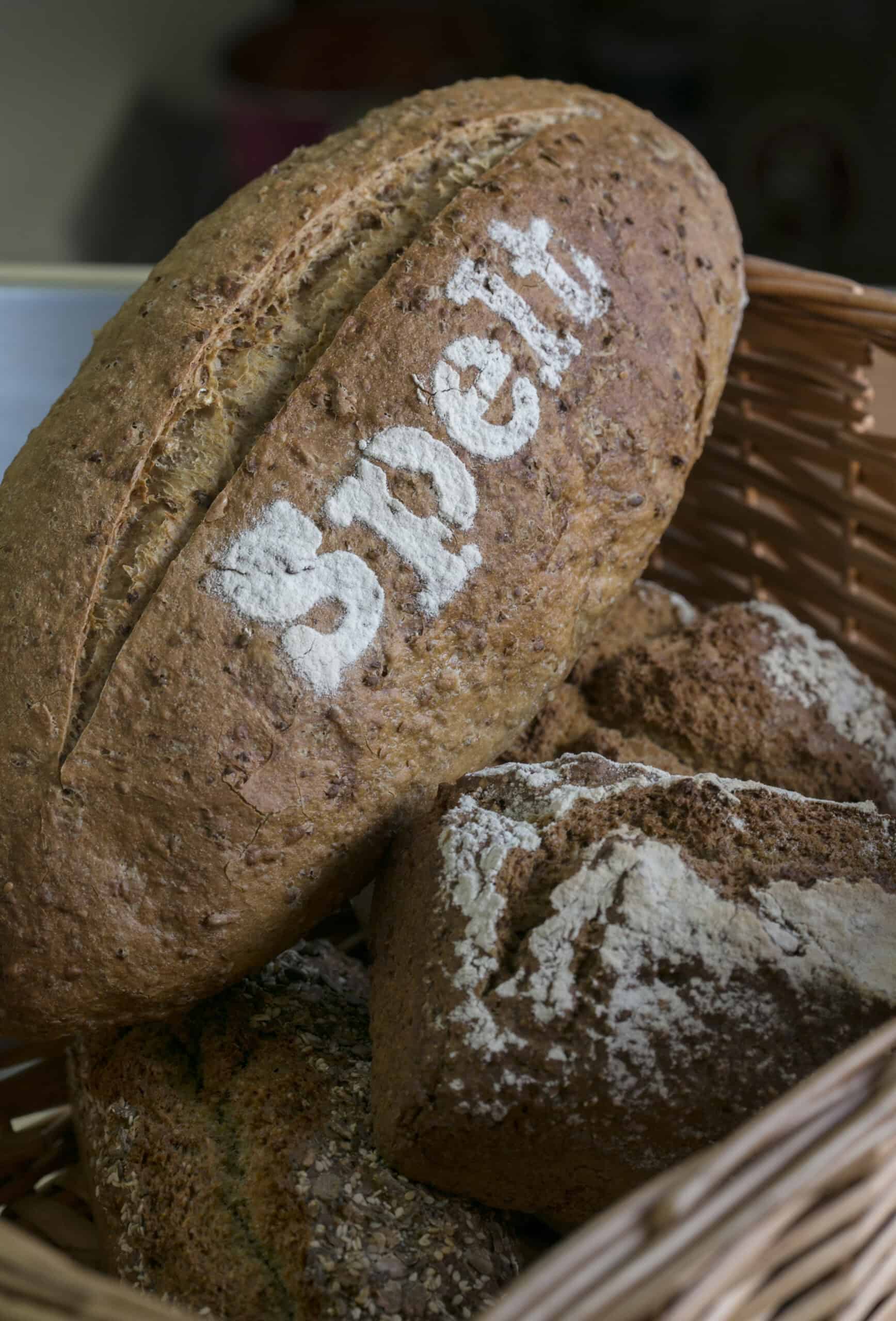Wholegrain bread with "Special" stamped, fresh baked in a bakery basket.